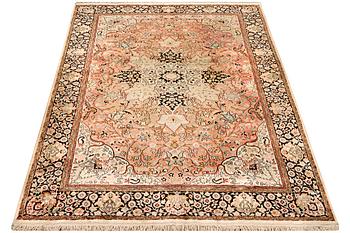 A silk Kashmar carpet, c. 280 x 177 cm.
