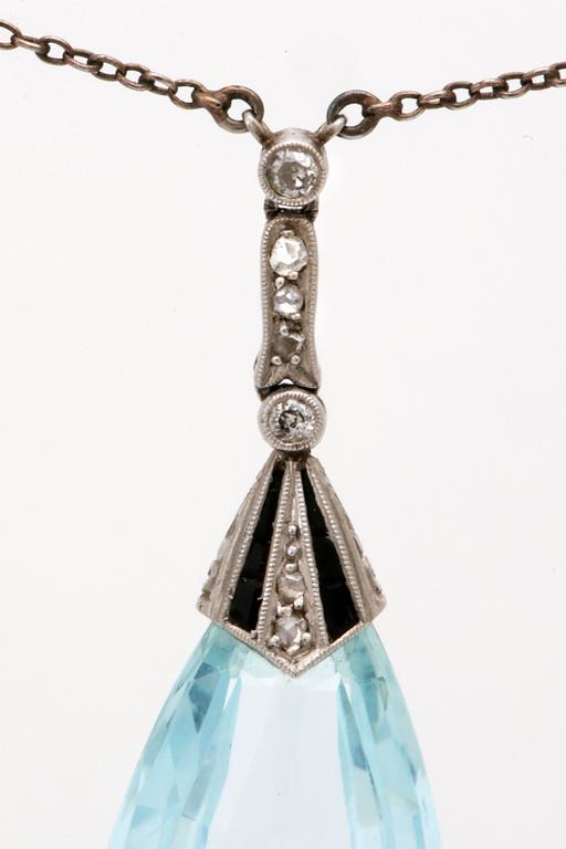 Aquamarine pendant on chain, low ct gold, 1 aquamarine height approx 2,5 cm, rose-cut diamonds and probably onyx.