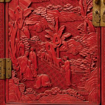 A carved  lacquer 'Kang'Cabinet, Qing dynasty, 18/19th Century.