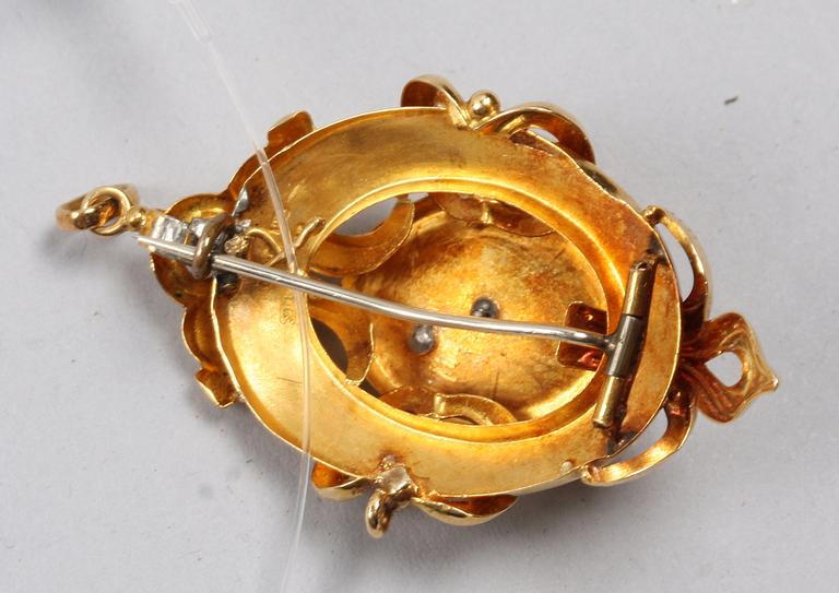 BROSCH/HÄNGE, 18k guld med pärla.