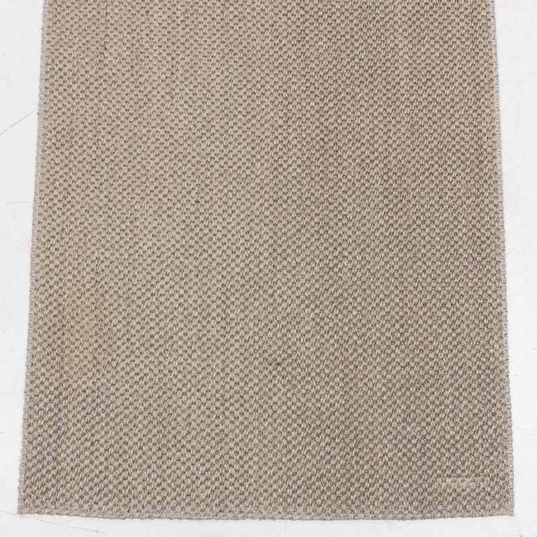 A runner carpet from NTK Atelier, Sweden, c. 448 x 87 cm.