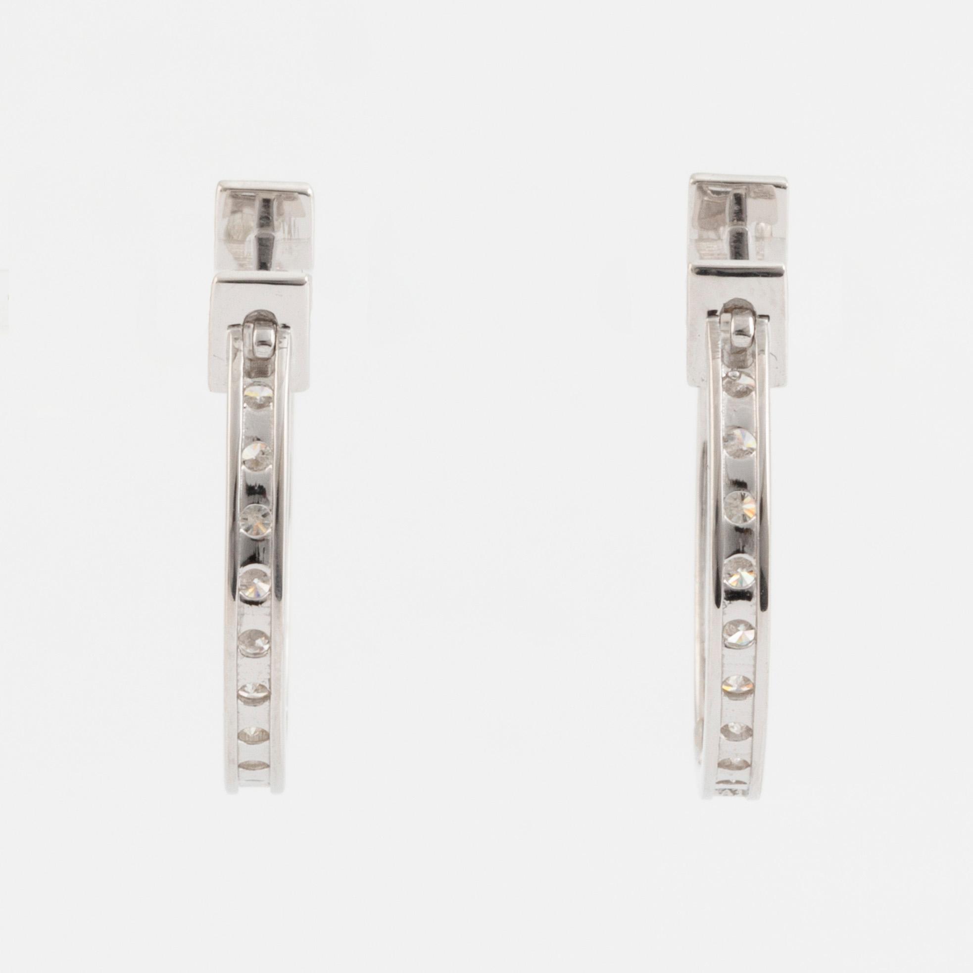 Brilliant cut diamond hoop earrings.