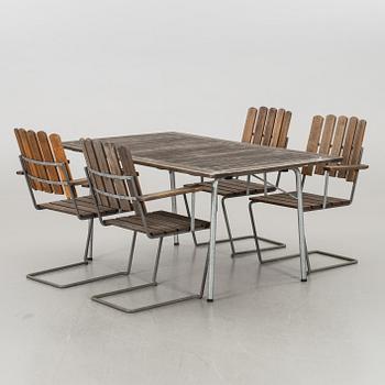 A GARDEN TABLE AND FOUR ARMCHAIRS FROM GRYTHYTTAN.