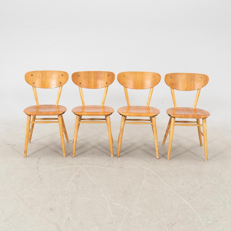 A set of four birch and teak veneered chairs from Bröderna Wigells stolfabrik, Malmbäck mid 20th century.