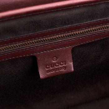 Gucci, a monogram canvas bag.