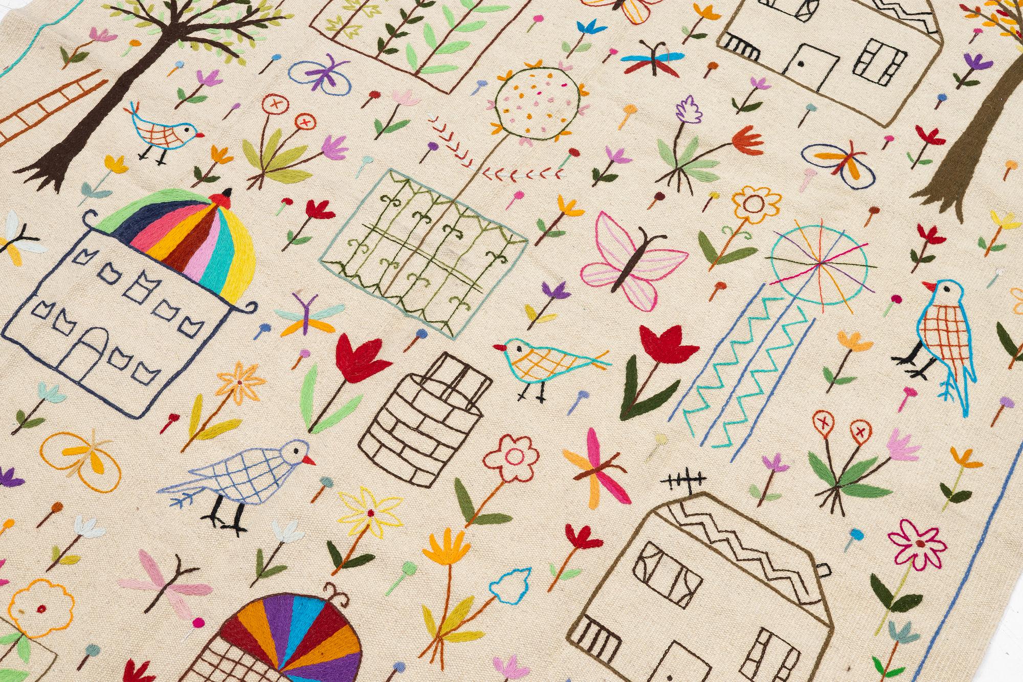A hand-embroidered kilim rug, c. 224 x 172 cm.
