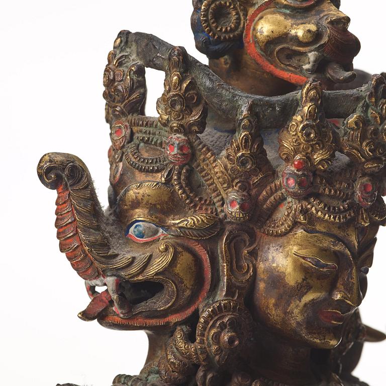 A large Tibetan eight armed deity, probably 20th Century.