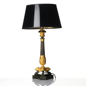 A French Louis Philippe ormolu and patinated bronze lamp, first part 19th century.