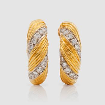 A pair of Kutchinsky brilliant-cut diamond earrings.