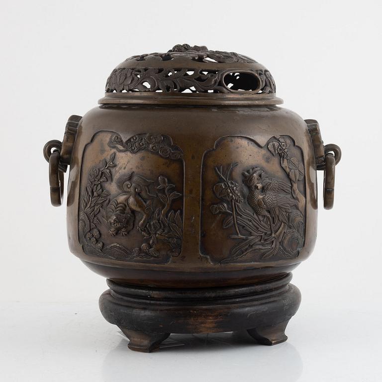 A bronze urn with stand, Japan, presumably Meiji (1868-1912).
