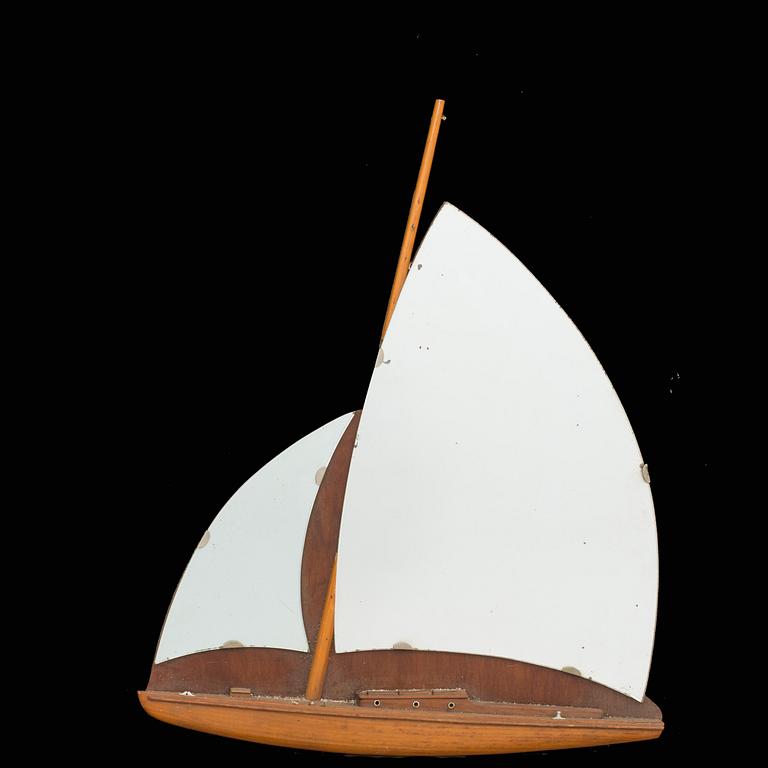 A BOAT SHAPED MIRROR, mid 20th century.