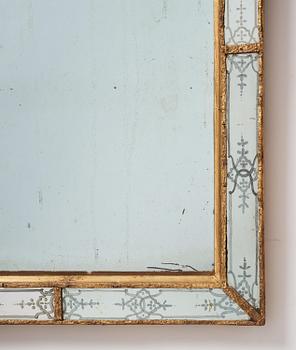 A Baroque gilt-lead and engraved glass mirror in the manner of Burchard Precht, early 18th century.