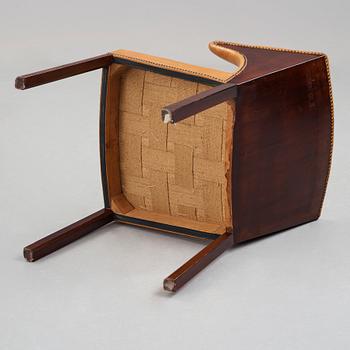 Frits Henningsen, a stained mahogany and brown leather armchair, Denmark.