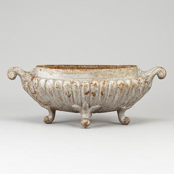 A 19th century cast iron garden jardiniere.