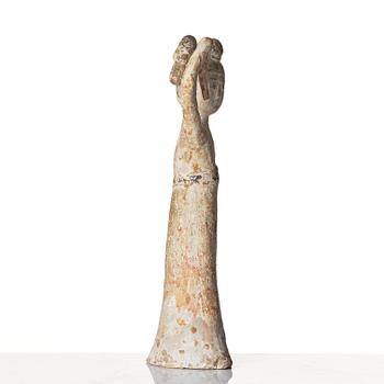 A painted pottery figure of a female dancer, Tang dynasty (608-906).