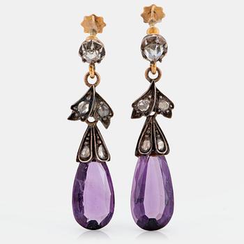 1038. A pair of 14K gold and silver earrings set with faceted amethysts and rose-cut diamonds.