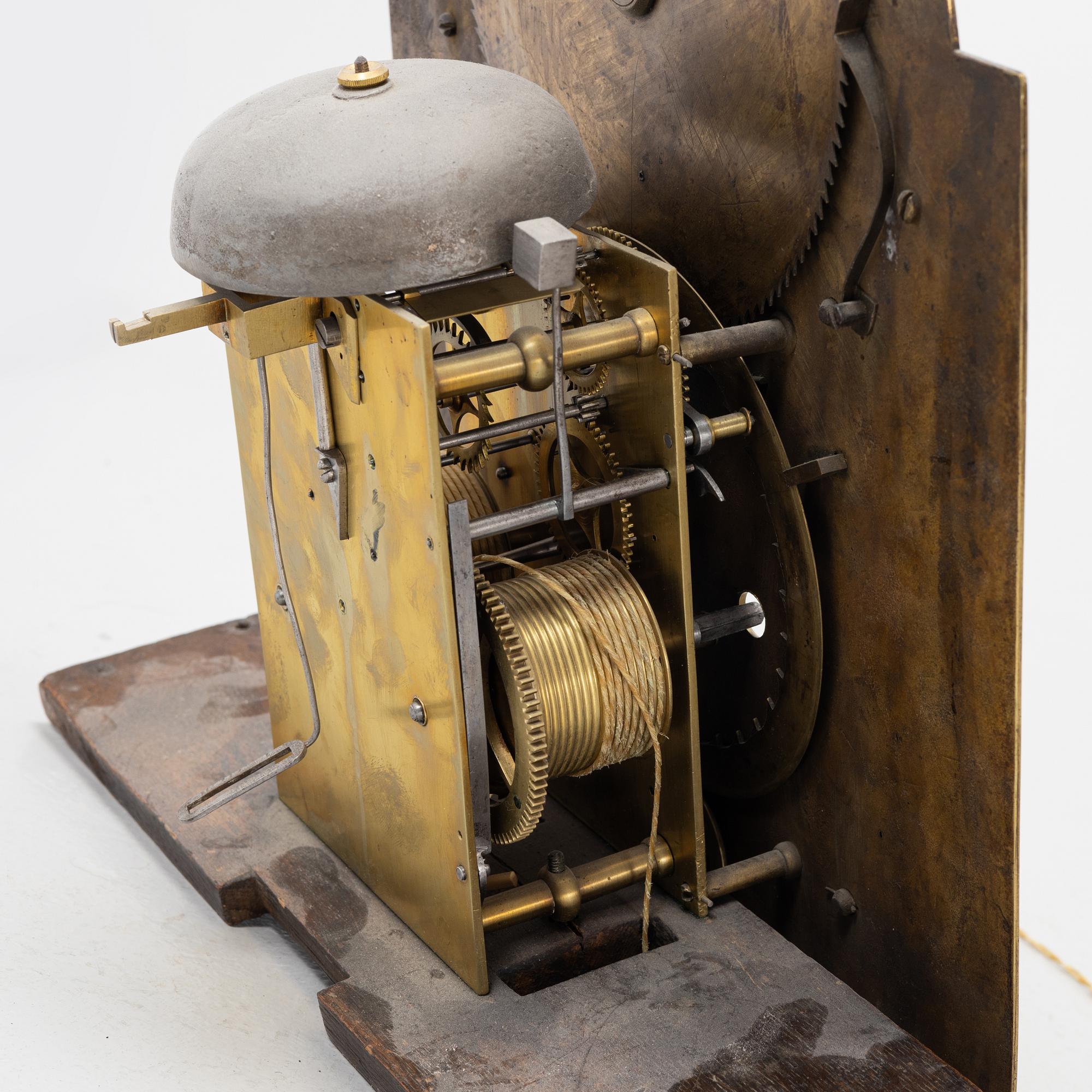 A mahogany veneered longcase clock, marked Peter Pohlmann, London, England, 18th century.