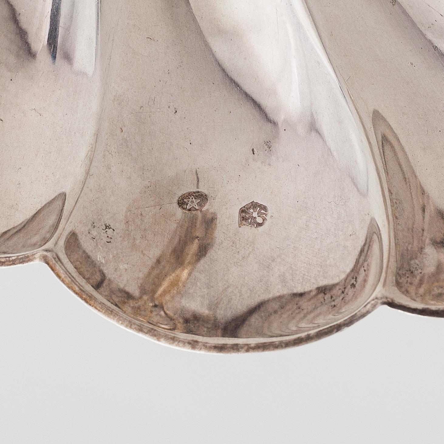 A scalloped silver dish, Pasgorcy, Madrid, Spain, after 1934.