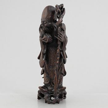 A Chinese wooden figure of 'Shoulao' with silver inlays, 20th century.