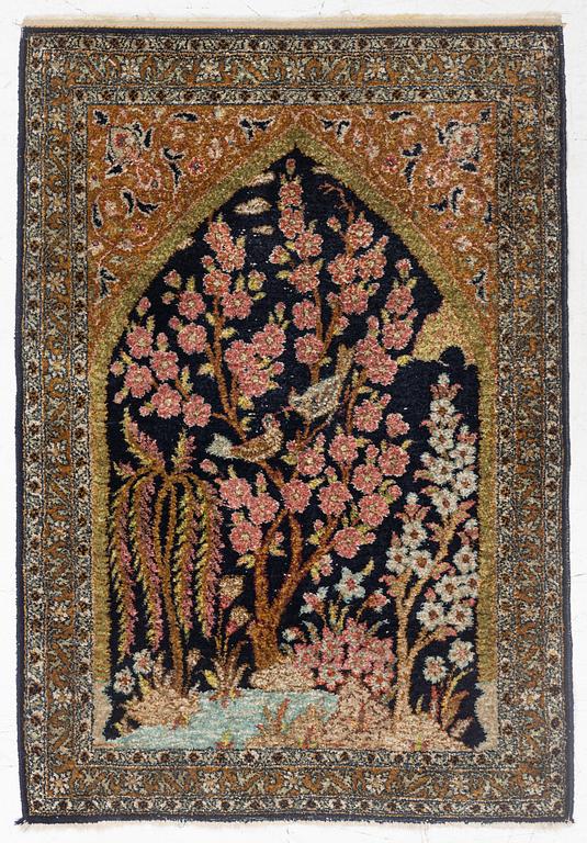 A semi-antique silk Ghom rug, central Iran, c. 32 x 23 in.