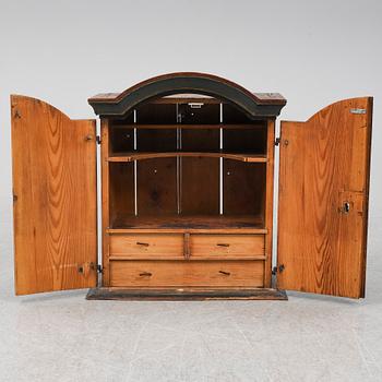 A painted pine wall cabinet, 19th Century.