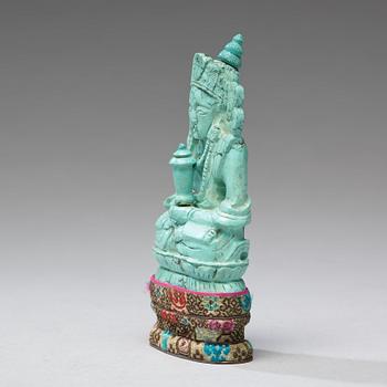 A turquoise figure of a bodhisattva, Tibet, late 19th Century.