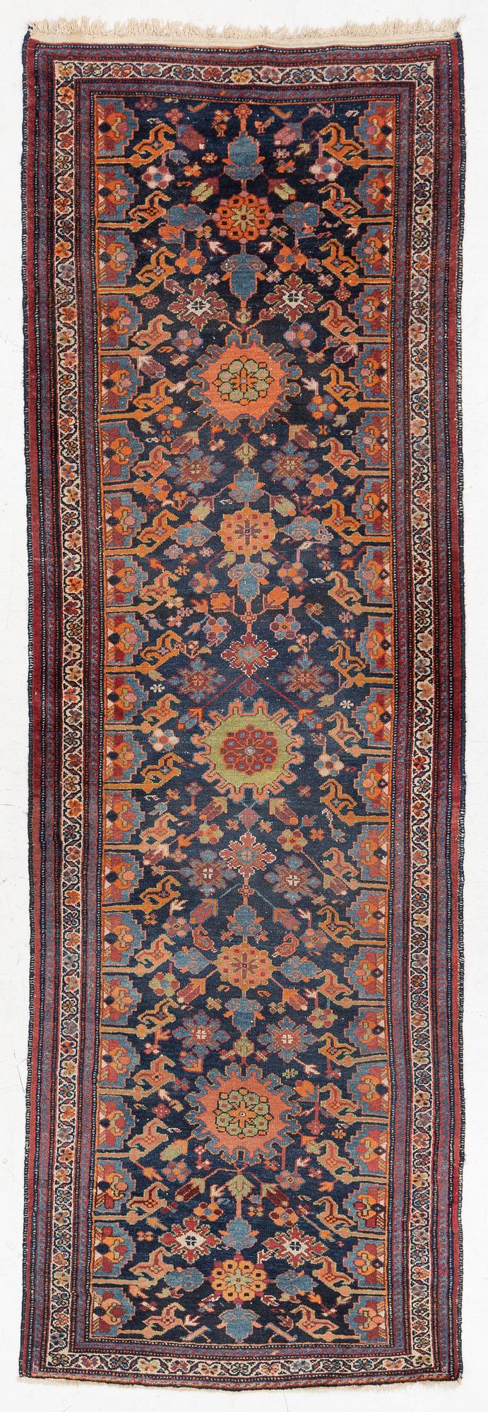 A north-west Persian, semi-antique runner, c. 340 x 110 cm.