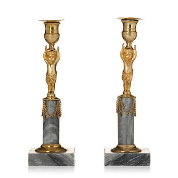 325. A pair of late Gustavian marble and gilt brass candlesticks, circa 1800.