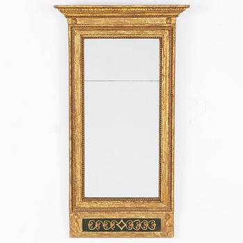 An Empire mirror, first half of the 19th Century.