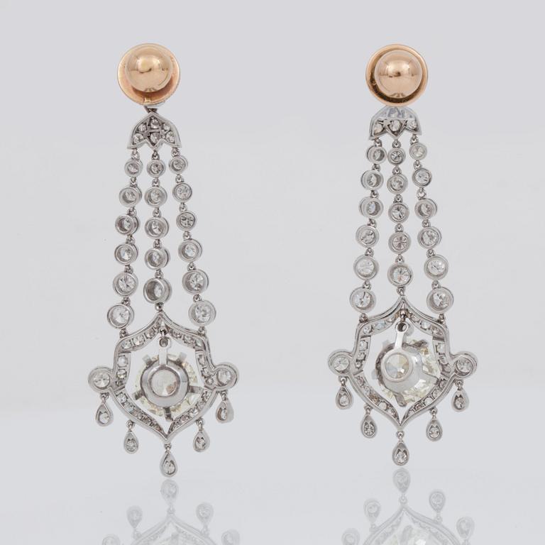 A pair of single-, brilliant-, and old-cut diamond earrings. Total carat weight circa 8.00 cts.