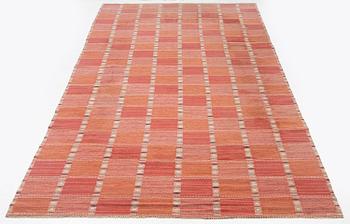 Barbro Nilsson, a carpet, 'Falurutan, röd Borås', flat weave, c. 502 x 212 cm, signed AB MMF BN.