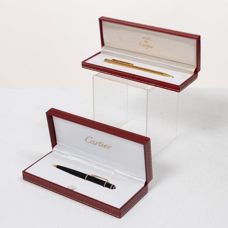 Cartier, Two ballpoint pens, 'must de Cartier' and 'Diabolo de Cartier'.