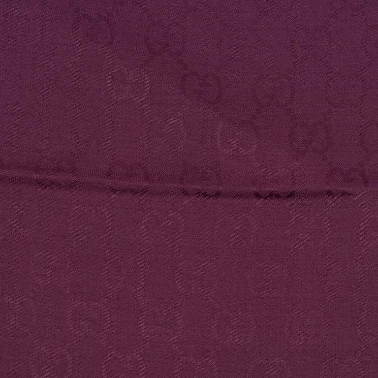Gucci, a wool and silk mix "GG" jaquard shawl.