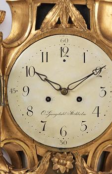 A Gustavian giltwood cartel clock by O. Ljundahl (watchmaker in Stockholm 1775-80).