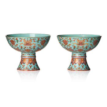 830. A pair of rare turquoise ground 'baijiaxiang' stemcups, Qing dynasty with Daoguang mark and period (1821-1850).