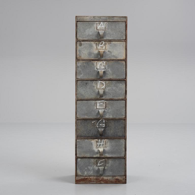 A contemporary metal chest of drawers.