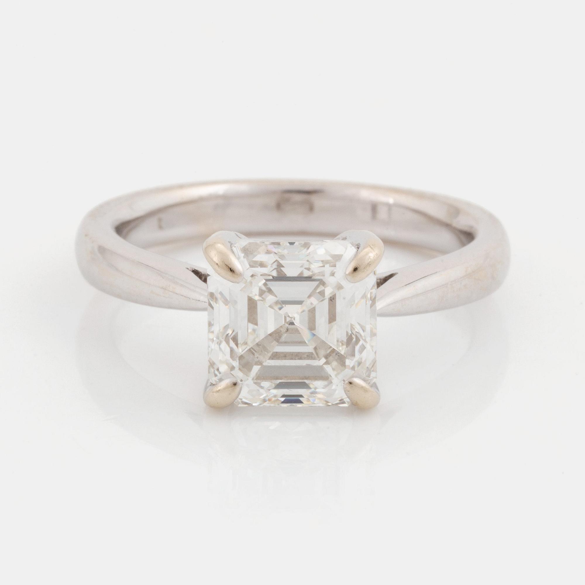 An 18K white gold ring set with an Asscher-cut diamond.