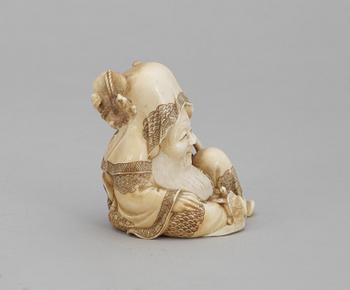 A Japanese ivory okimono figure of Sholaou, Meiji period.