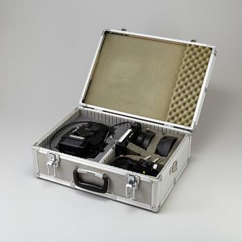 A black Mamiya RZ67 Pro Medium Format Camera Body with sekor z f = 110 mm 1:2.8 and sekor c f = 50 mm 1:4.5 lens.