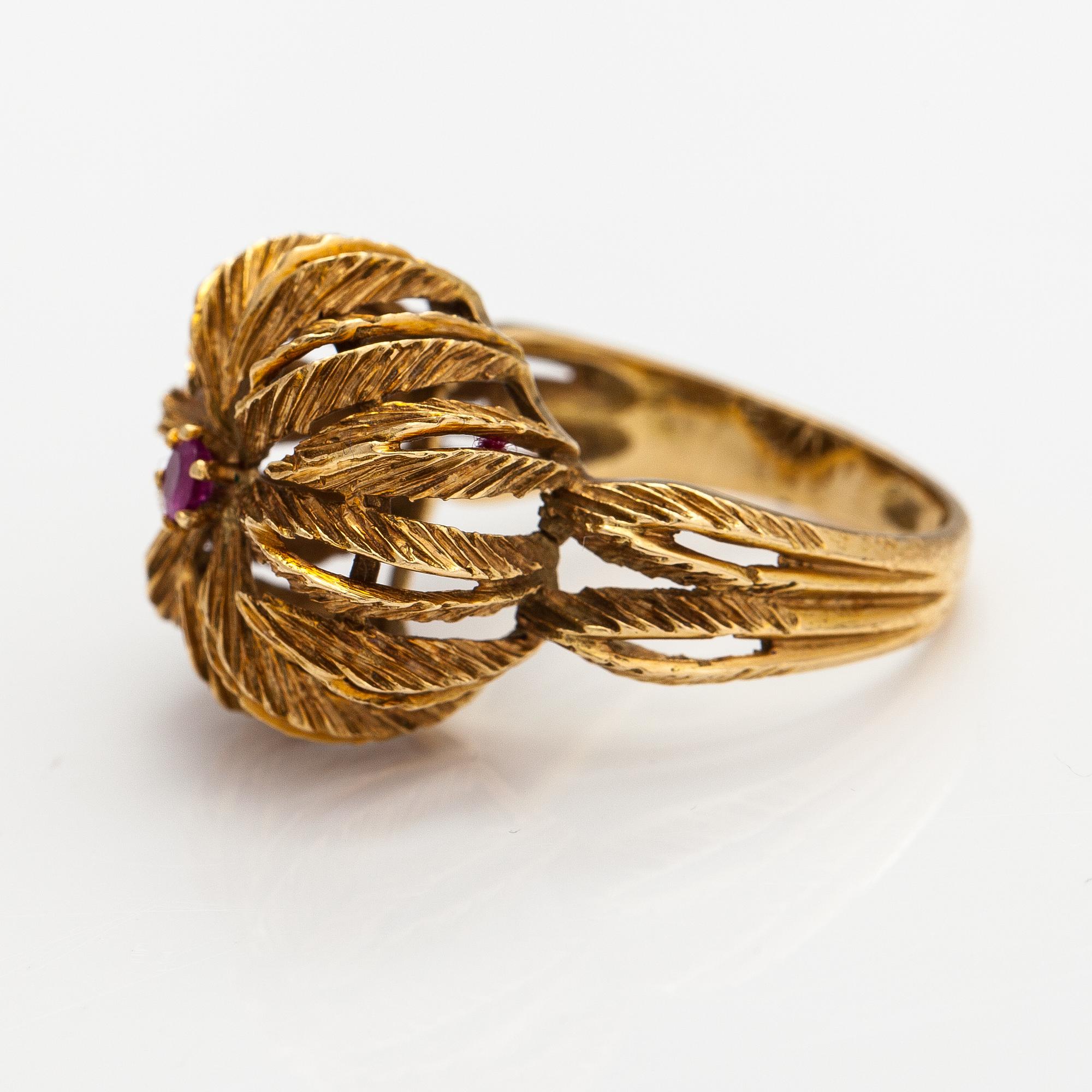An 18K gold ring with a ruby.
