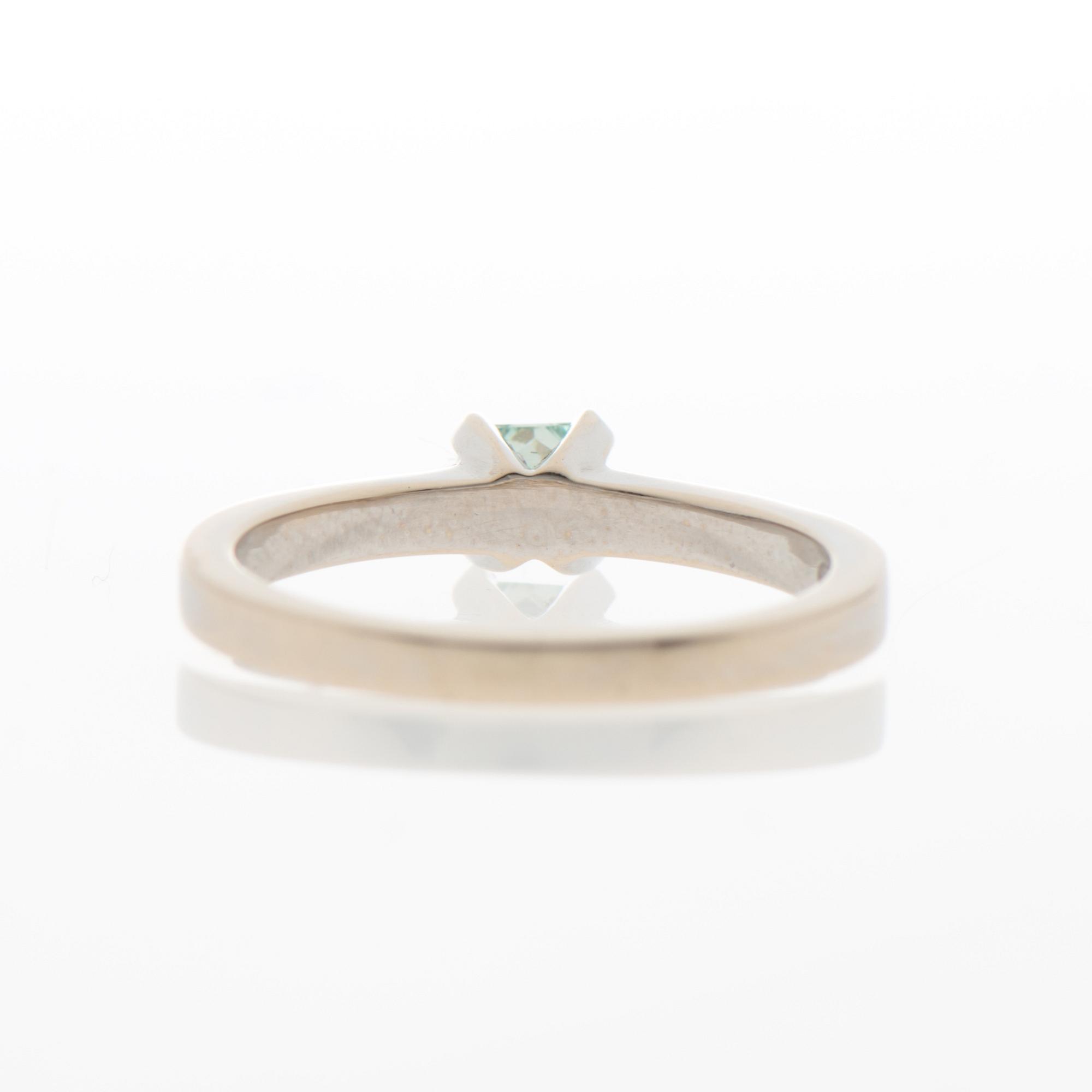 A RING, treated green diamond, 14K white gold.