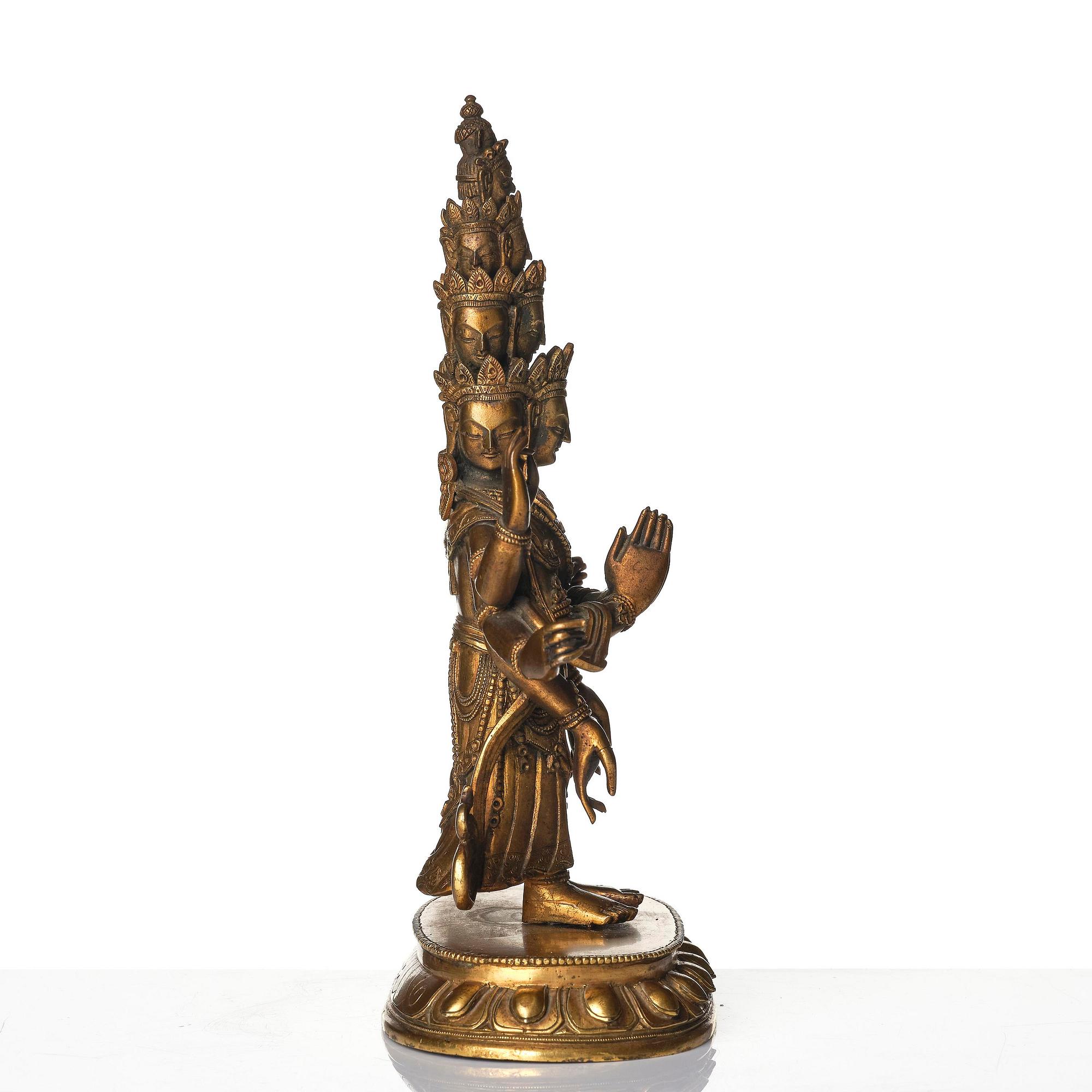 A Tibeto-Chinese gilt bronze figure of Avalokiteshvara Ekasdashamukra, 19th century.