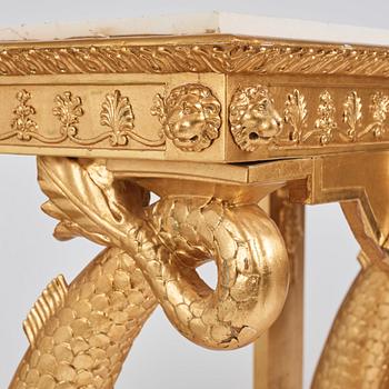 A pair of Swedish Empire carved and giltwood console tables, first half of the 19th century.