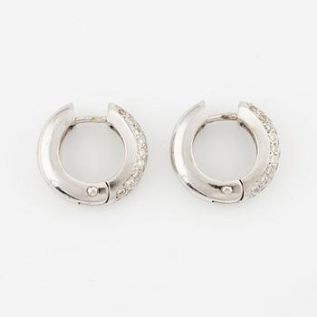 A pair of earrings in 18K white gold with round brilliant-cut diamonds.