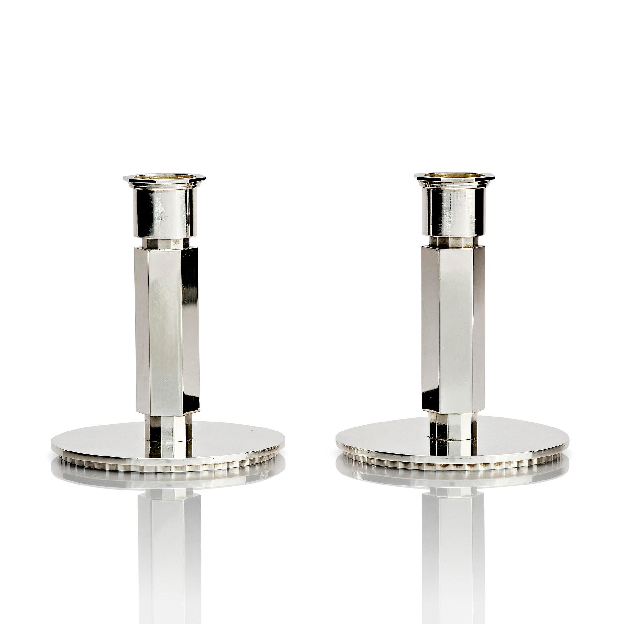 Wiwen Nilsson, a pair of sterling silver candlesticks, Lund, Sweden 11957 and 1960.