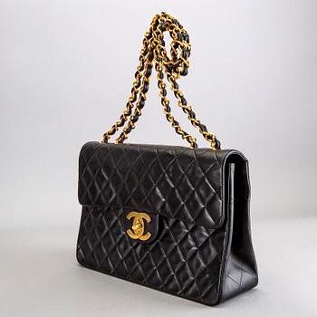 A Chanel maxi jumbo leather bag.