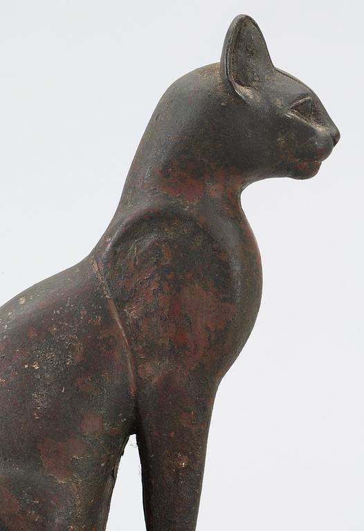 A bronze cat statuette, Egypt, possibly 22-30 Dynasty, 945-332 BC.