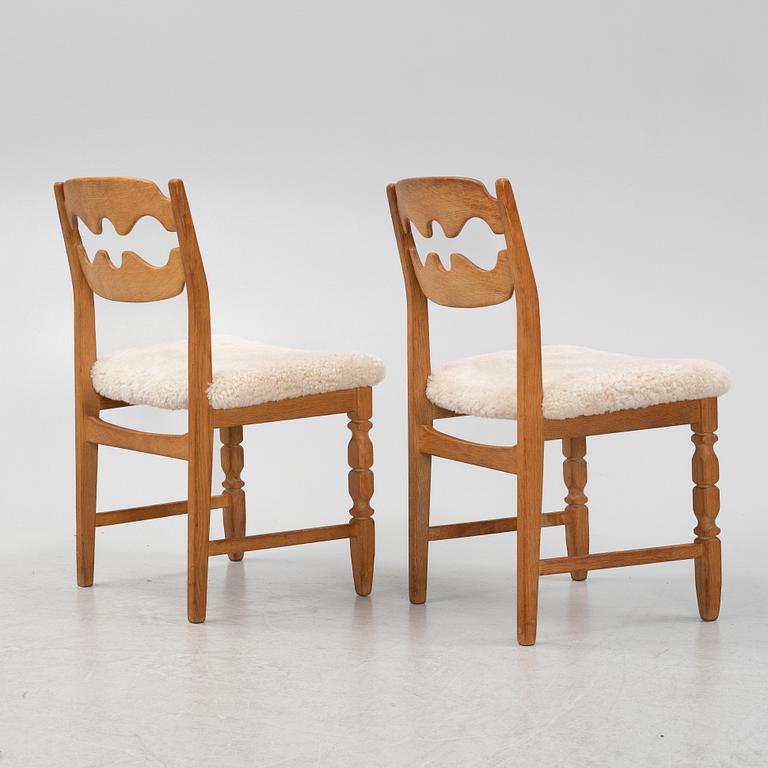 Henning Kjærnulf, a set of six oak 'razorblade' chairs, with new sheepskin upholstery, for EGK, 1960s.