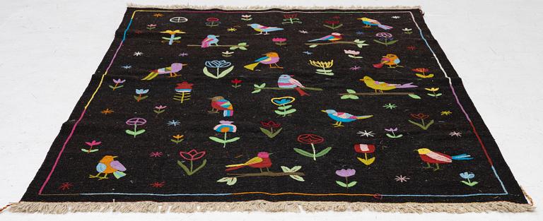 A hand-embroidered Kelim rug, 204 x 150 cm.