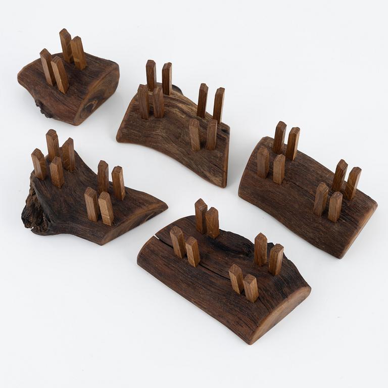 Magnus Ek, a set of five oak wood snack holders for Oaxen Krog, 2021.